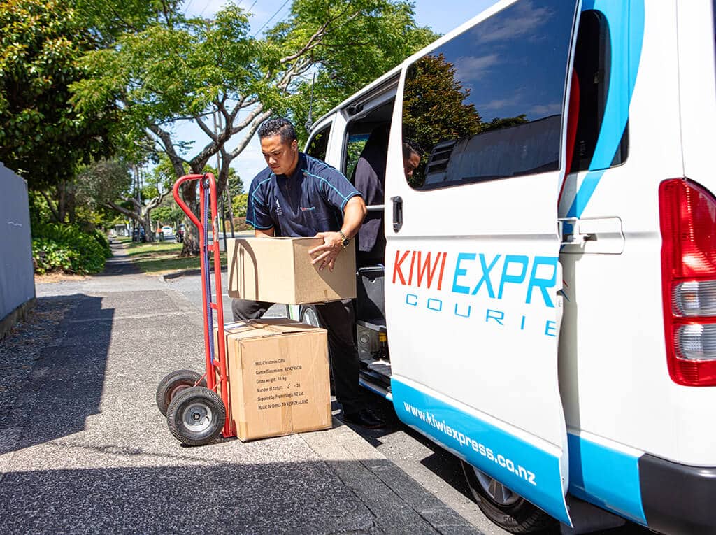 Local man in a van courier service loads and unloads your goods.